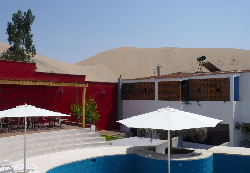 Pool at Villa Jazmin at Nazca with Dune in background